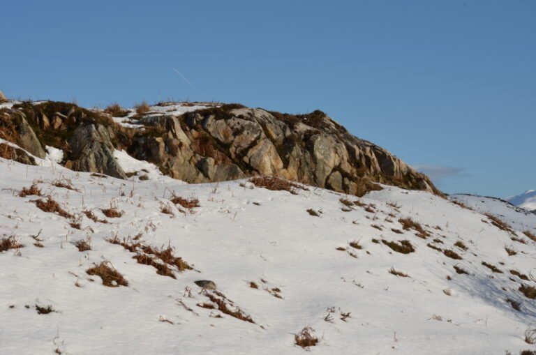 ROCKY CROP IN SNOW